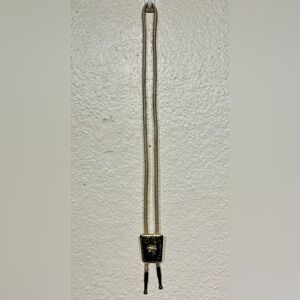 Vintage western gold-toned metal bolo tie